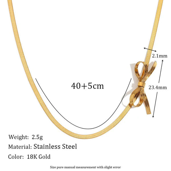 Gold stainless steel snake chain necklace with a bow-shaped knot pendant, shown with measurement annotations (40+5cm length, 2.1mm, 23.