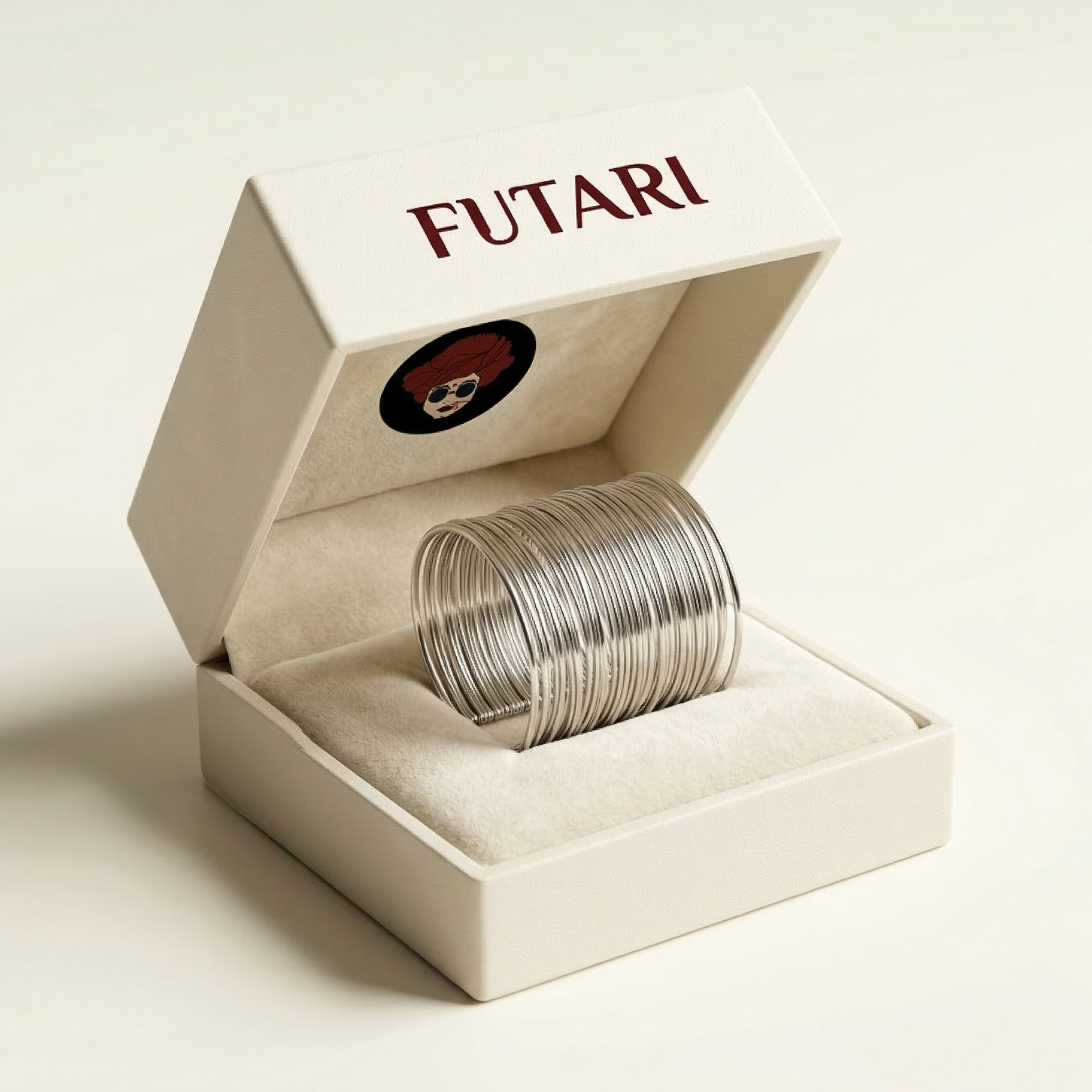 Silver bracelets in an open box with 'FUTARI' branding on a beige background