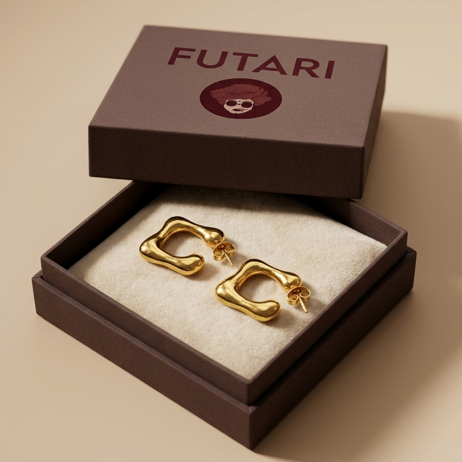 Gold earrings in a 'FUTARI' branded box on a beige background