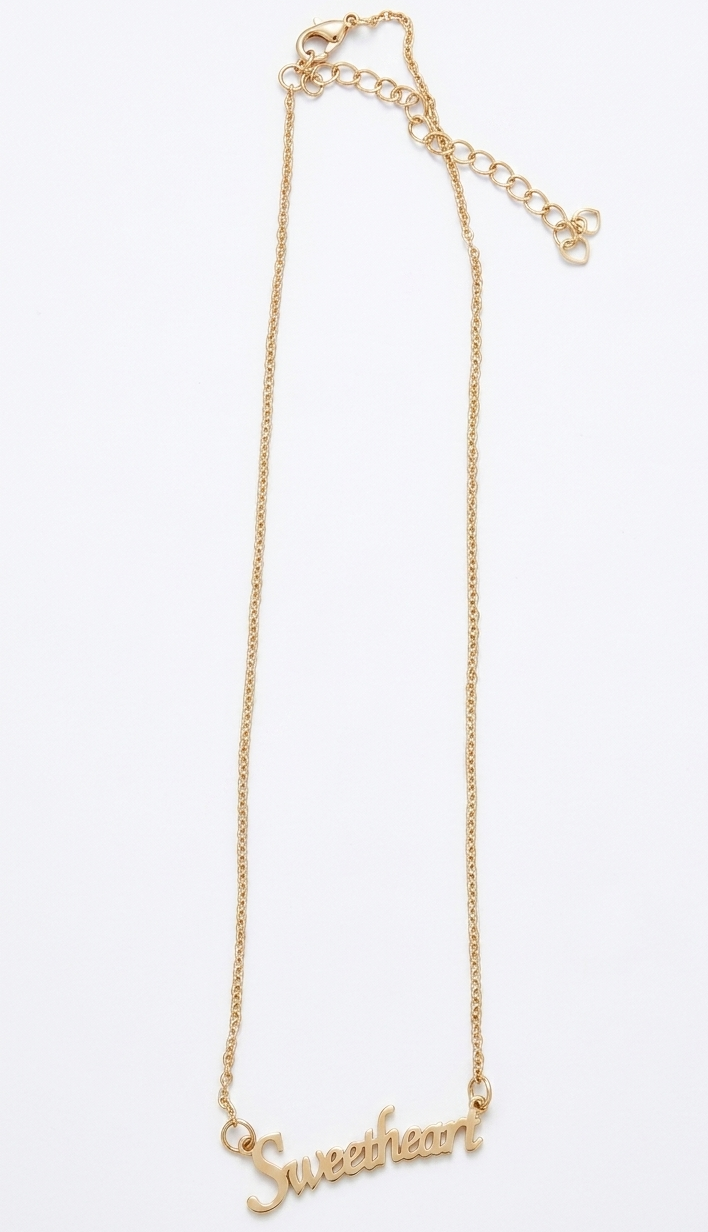 Gold necklace with 'Sweetheart' pendant on a white background