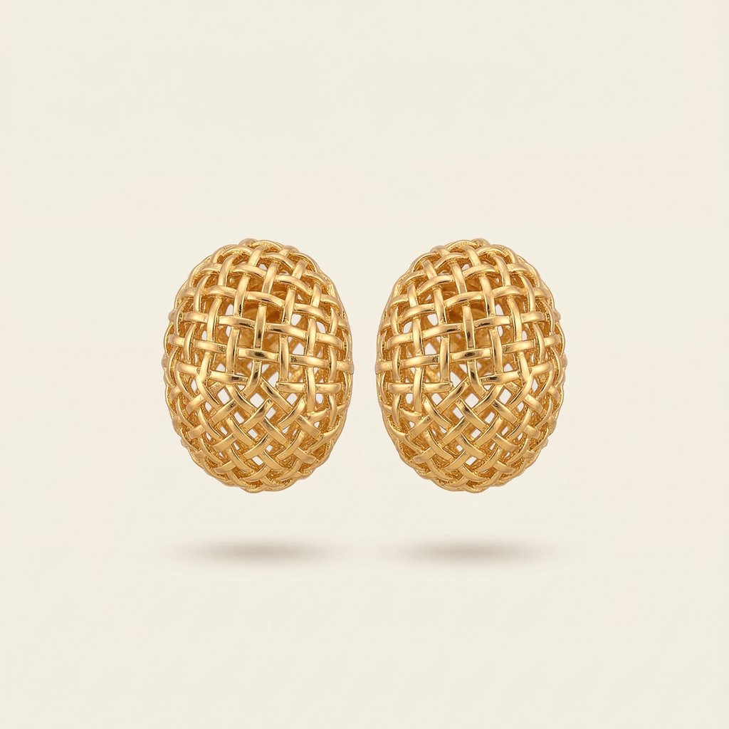 Pair of gold woven earrings on a beige background