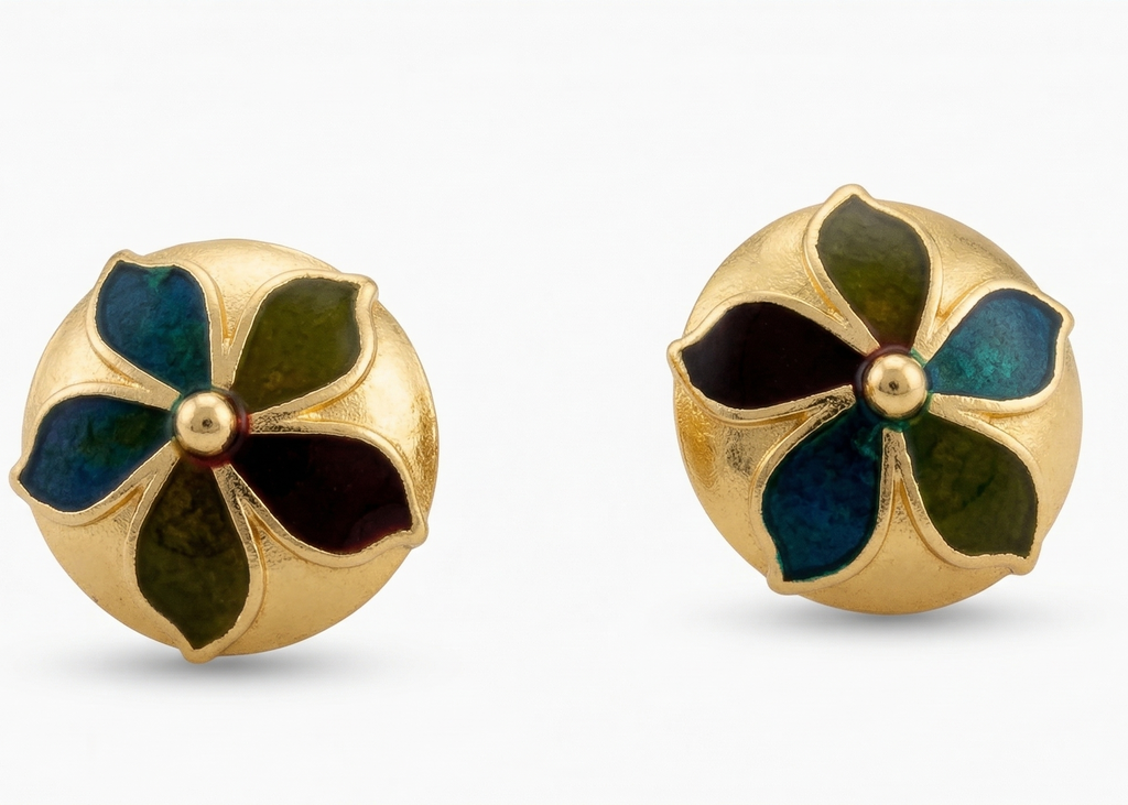 Pair of gold earrings with green and black floral designs on a white background