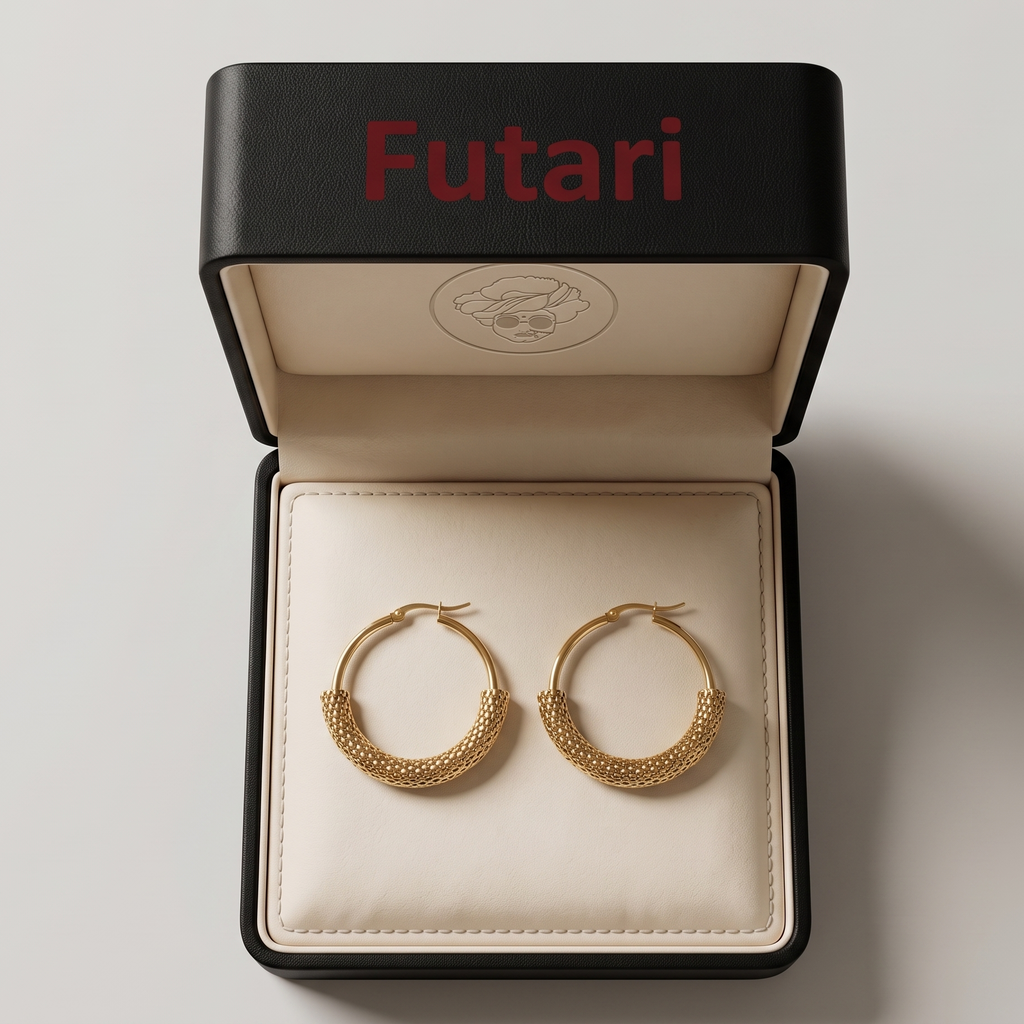 Gold hoop earrings in a 'Futari' jewelry box on a light gray background