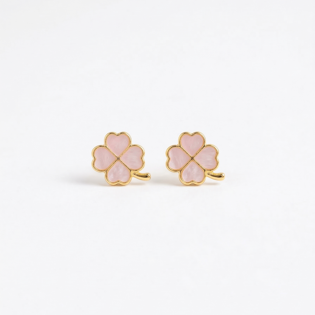 Pair of pink clover-shaped earrings with gold accents on a white background