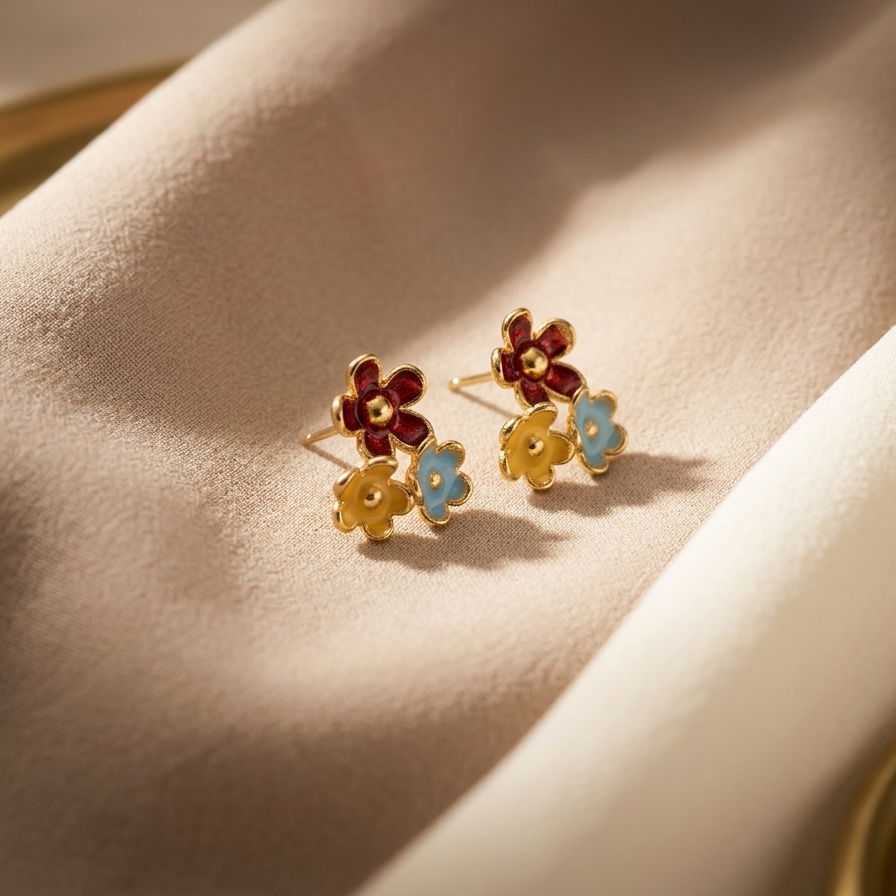 Floral earrings with colored stones on a soft beige background