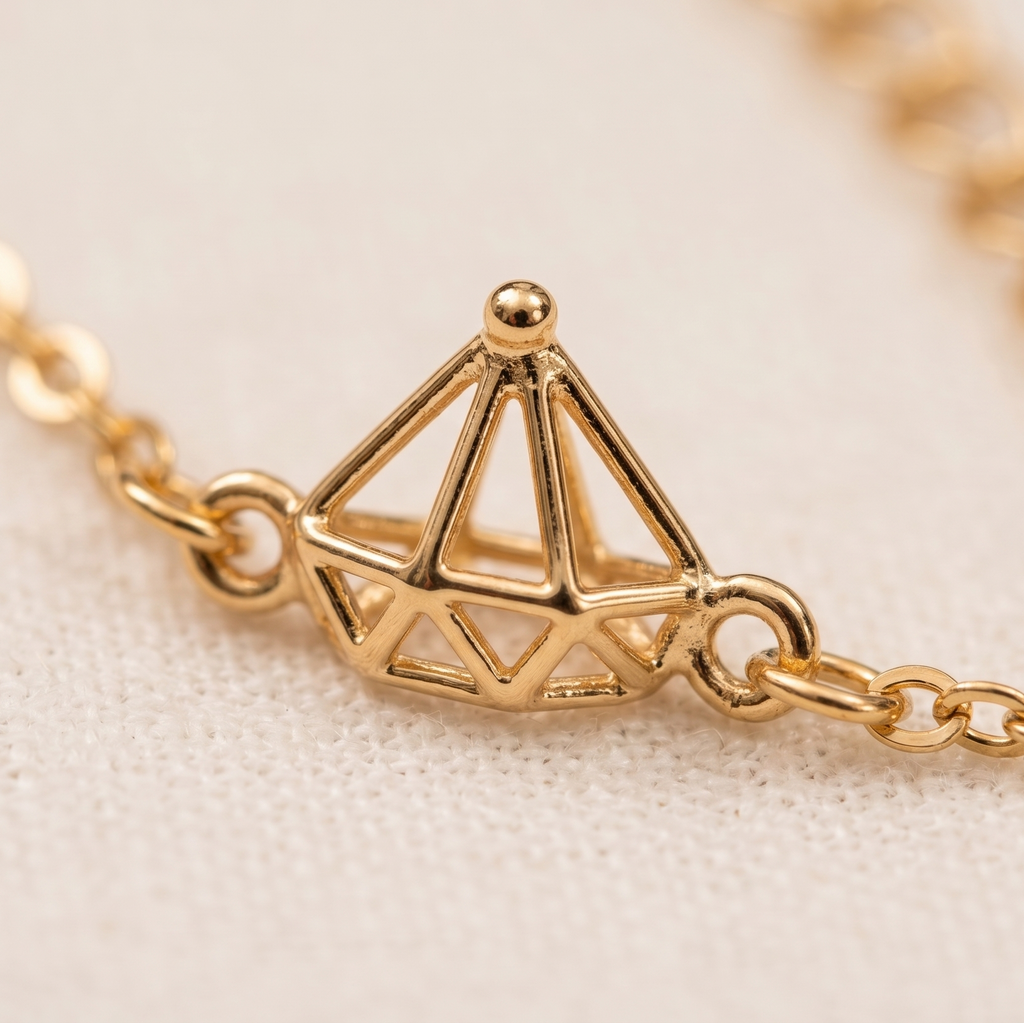 Gold bracelet with geometric charm on a soft beige background