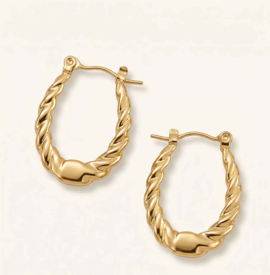 Gold hoop earrings on a white background