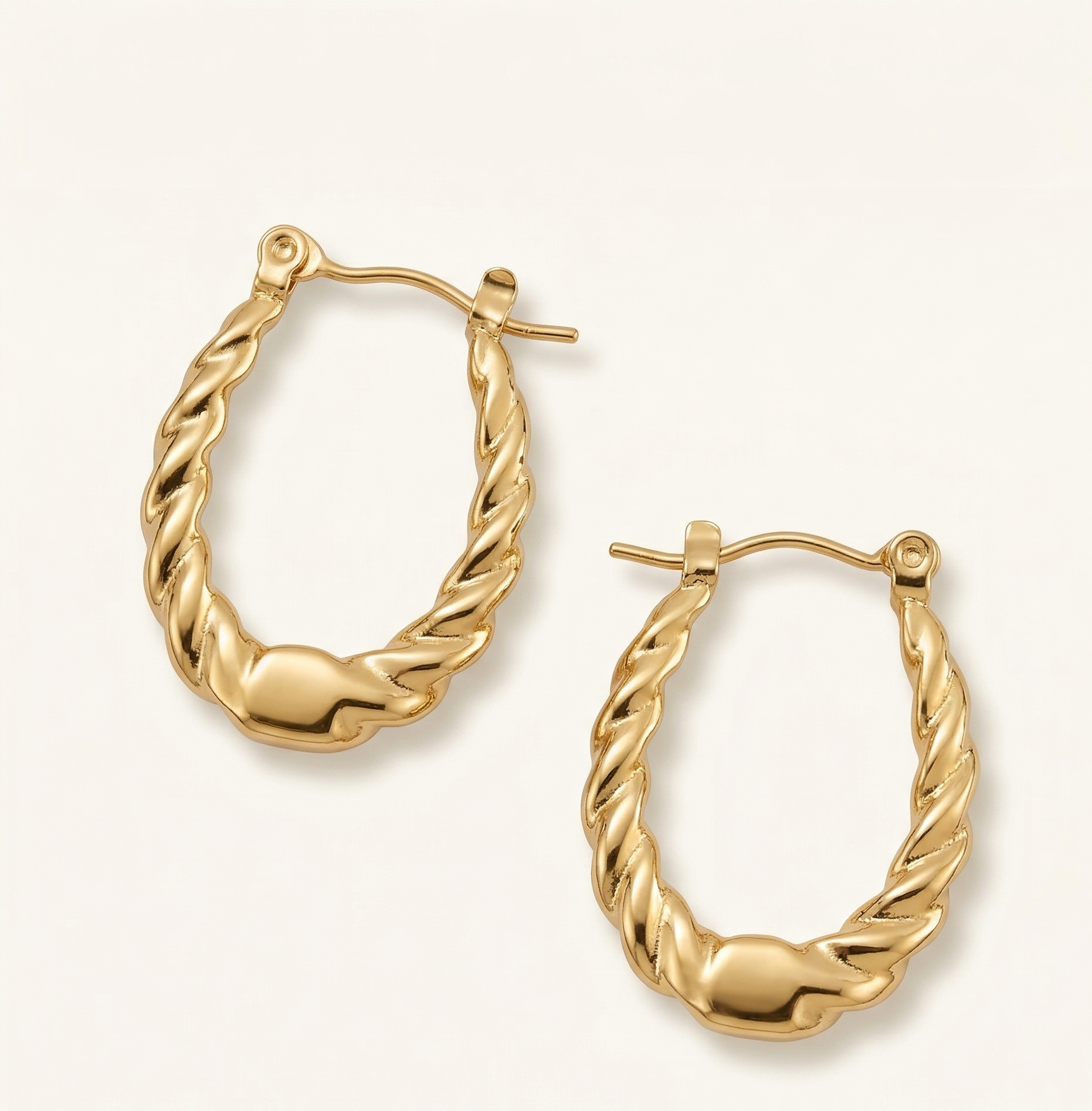 Gold hoop earrings on a white background