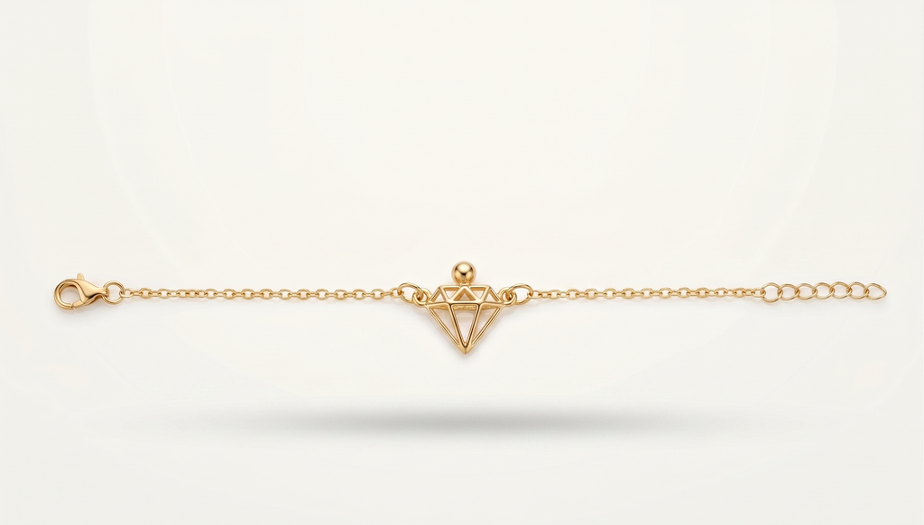 Gold bracelet with a geometric design on a white background