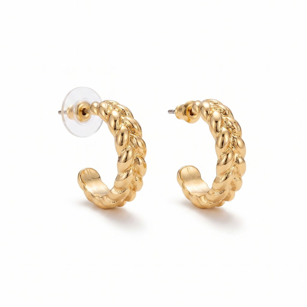 Gold hoop earrings on a white background