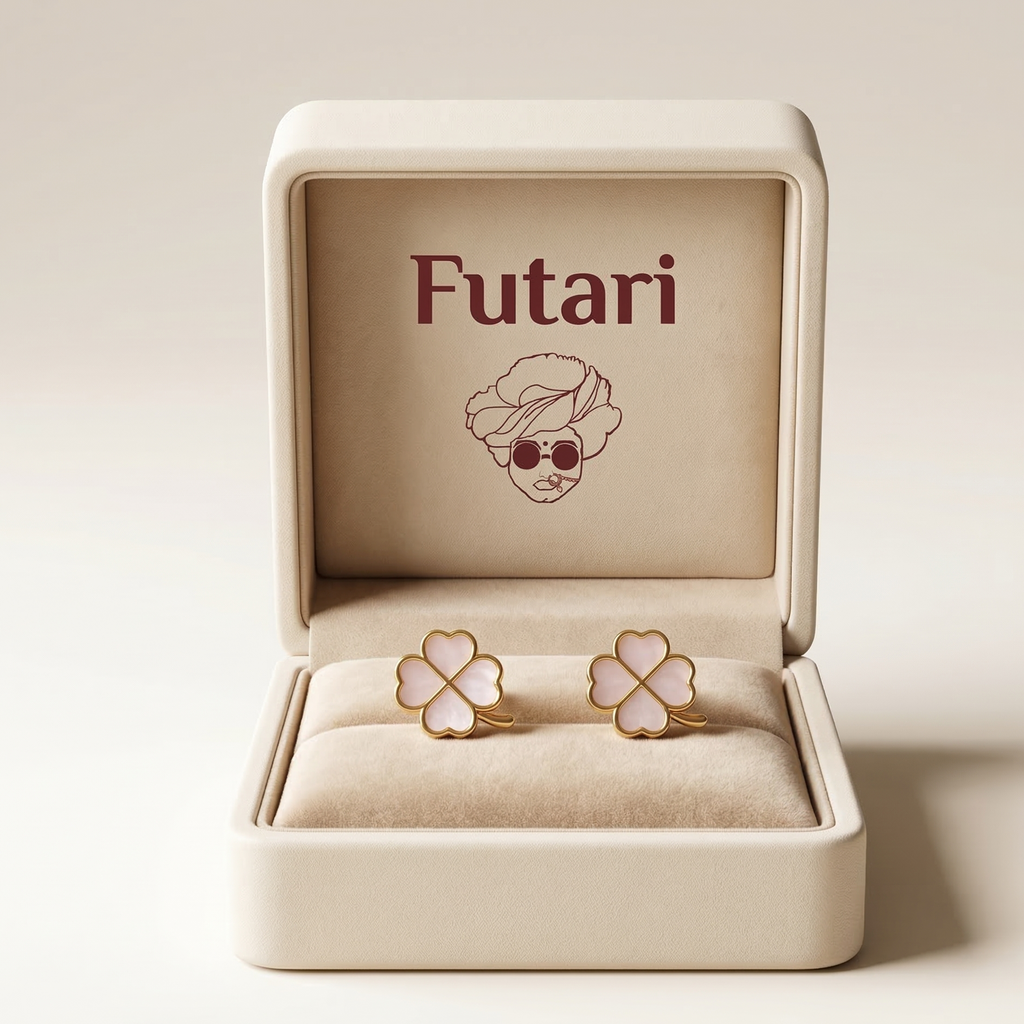 Four-leaf clover earrings in a 'Futari' branded box on a beige background