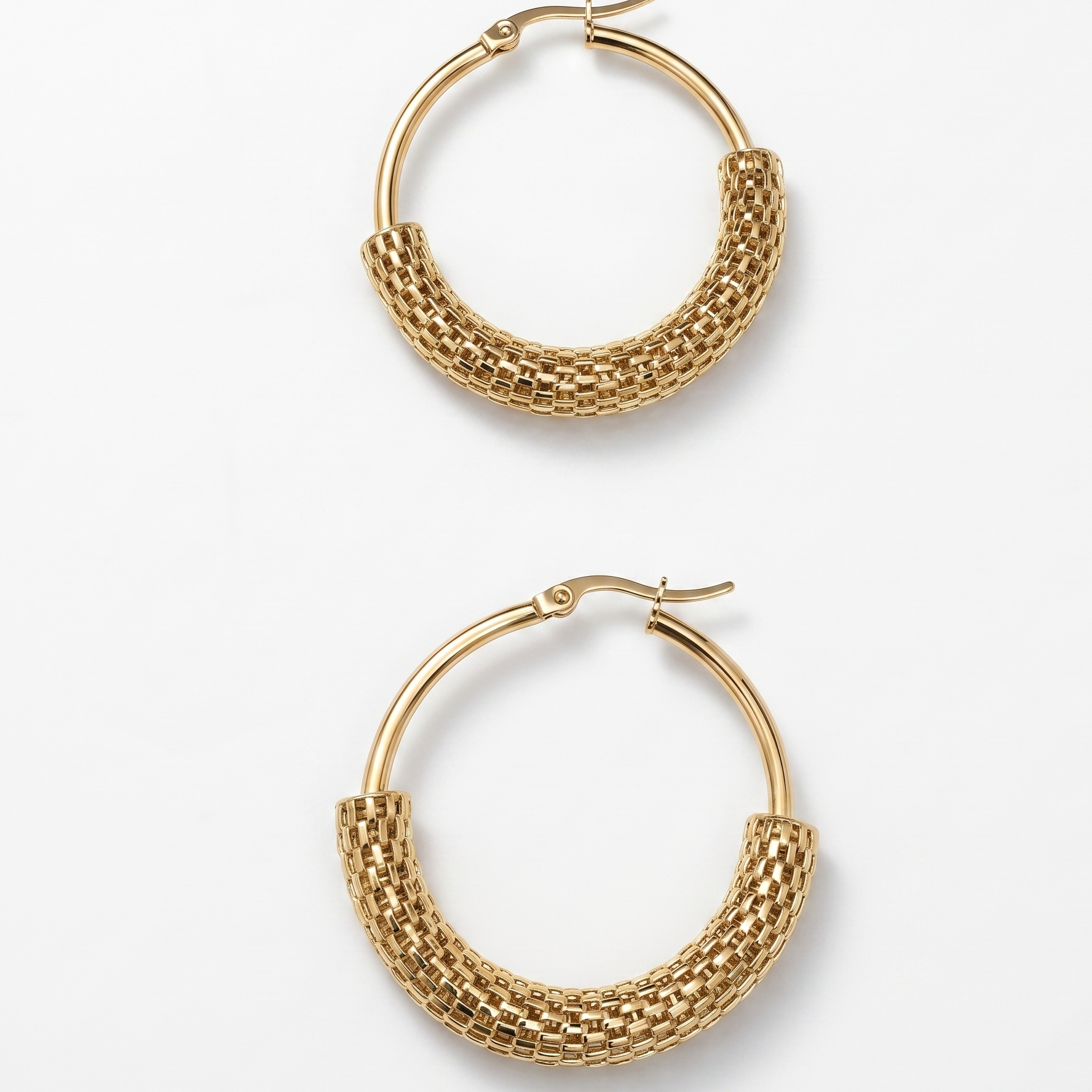 Pair of gold hoop earrings on a white background
