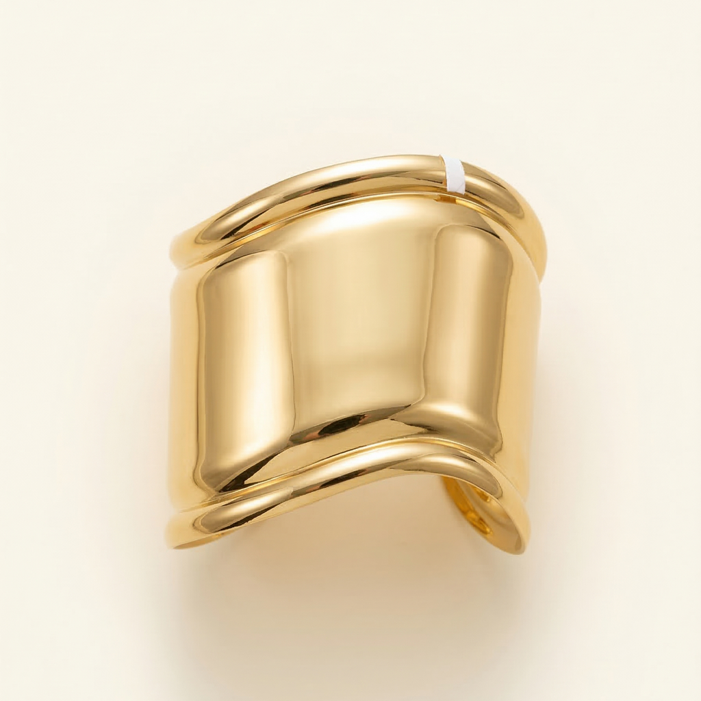 Gold ring on a light beige background