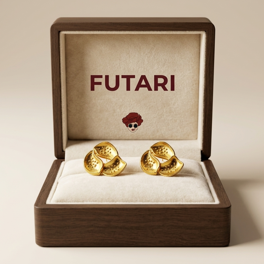 Gold earrings in a wooden box with 'FUTARI' branding on a beige background