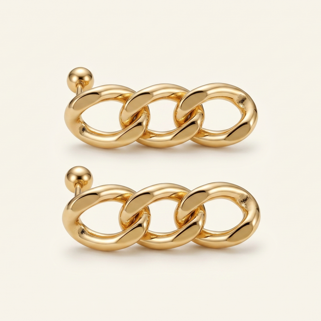 Pair of gold chain stud earrings on a light beige background