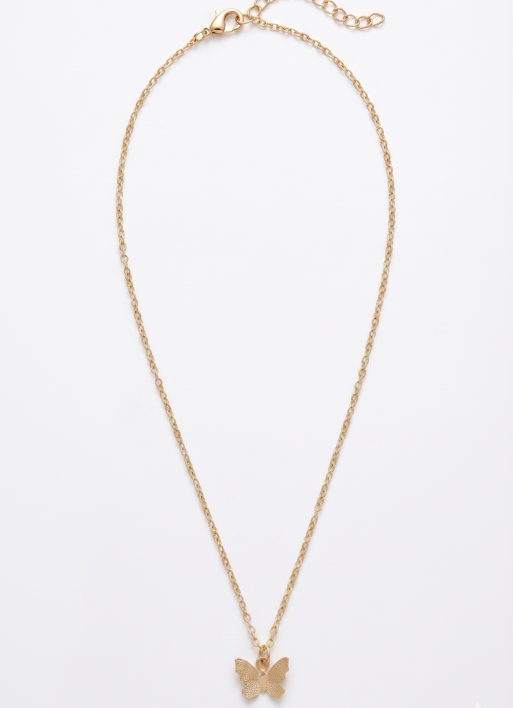 Gold butterfly necklace on a white background