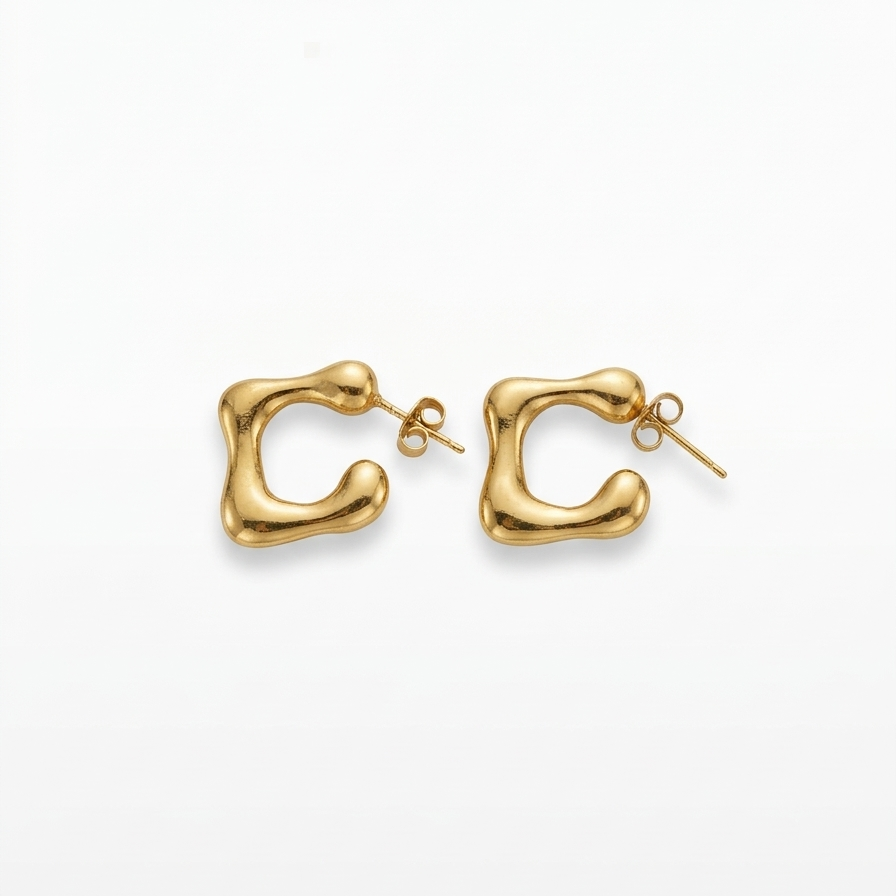 Gold hoop earrings on a white background