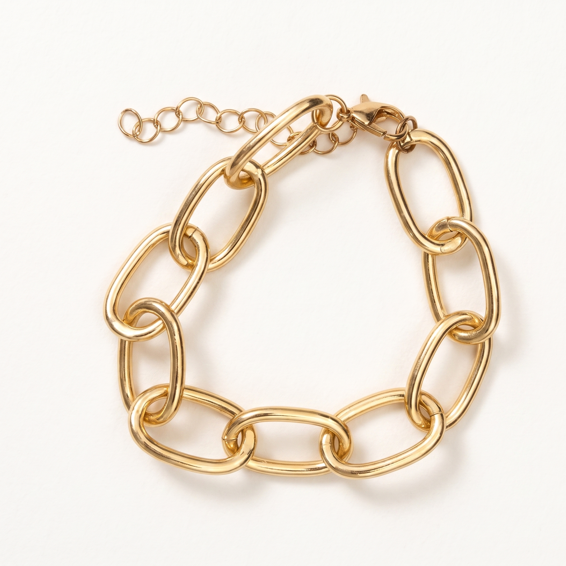 Gold chain bracelet on a white background