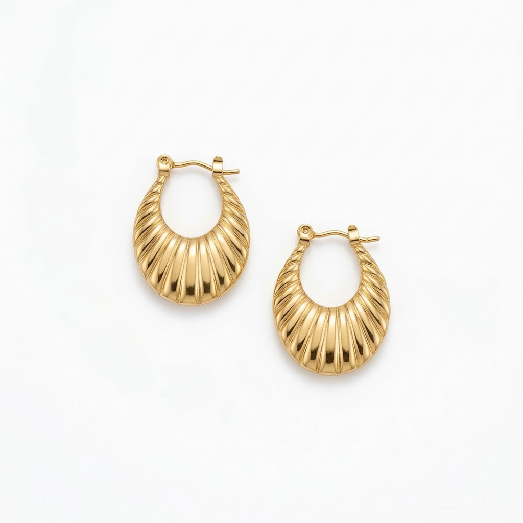 Gold hoop earrings on a white background