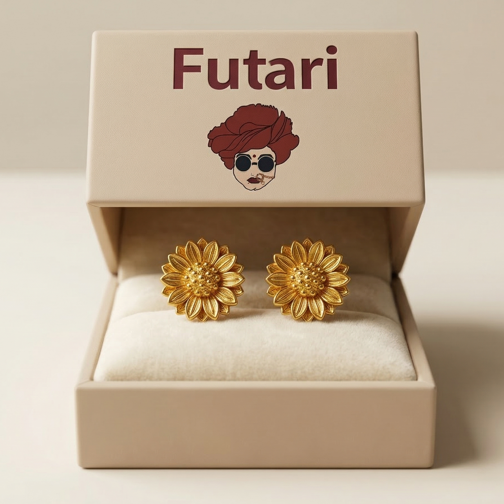 Gold flower-shaped earrings in a 'Futari' branded box on a beige background
