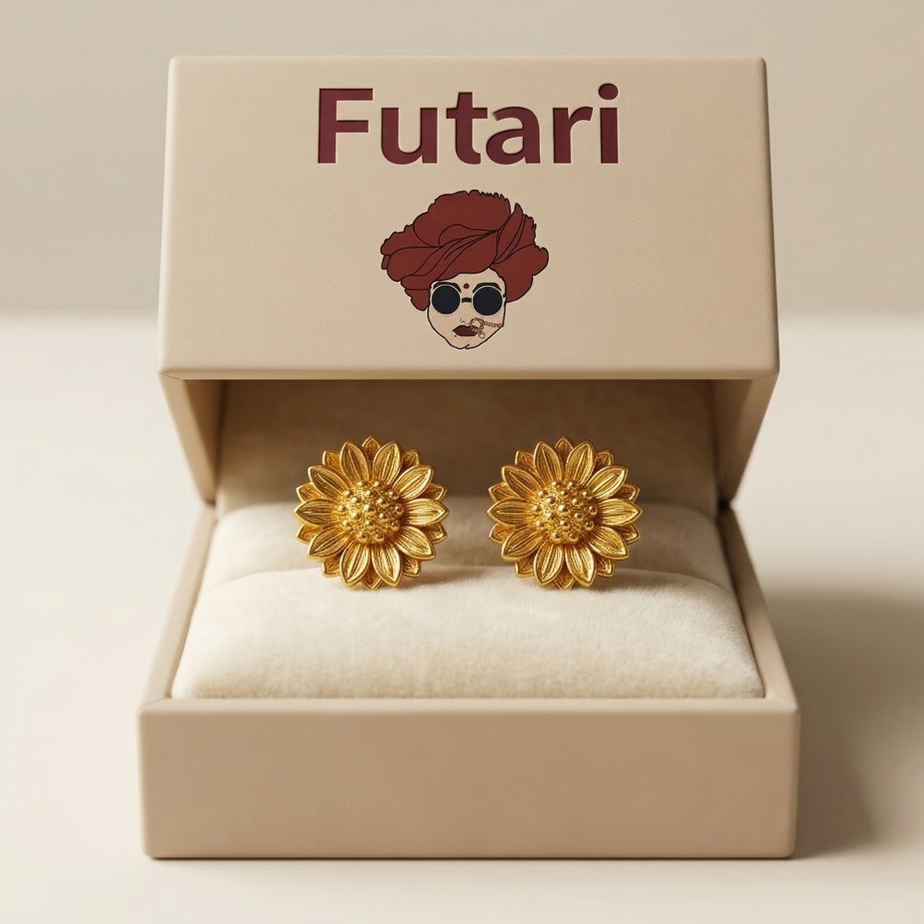 Gold flower-shaped earrings in a 'Futari' branded box on a beige background