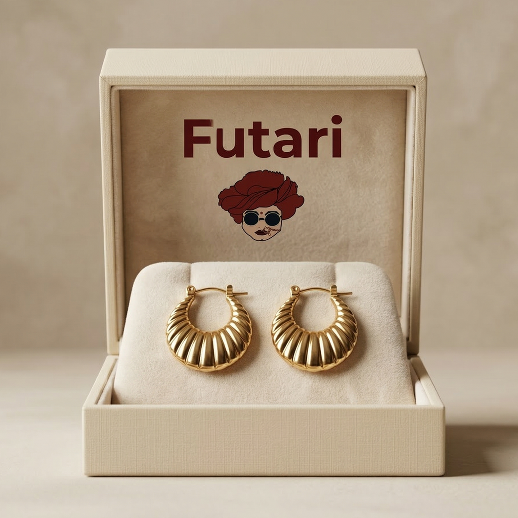 Gold hoop earrings in a 'Futari' branded box on a beige background