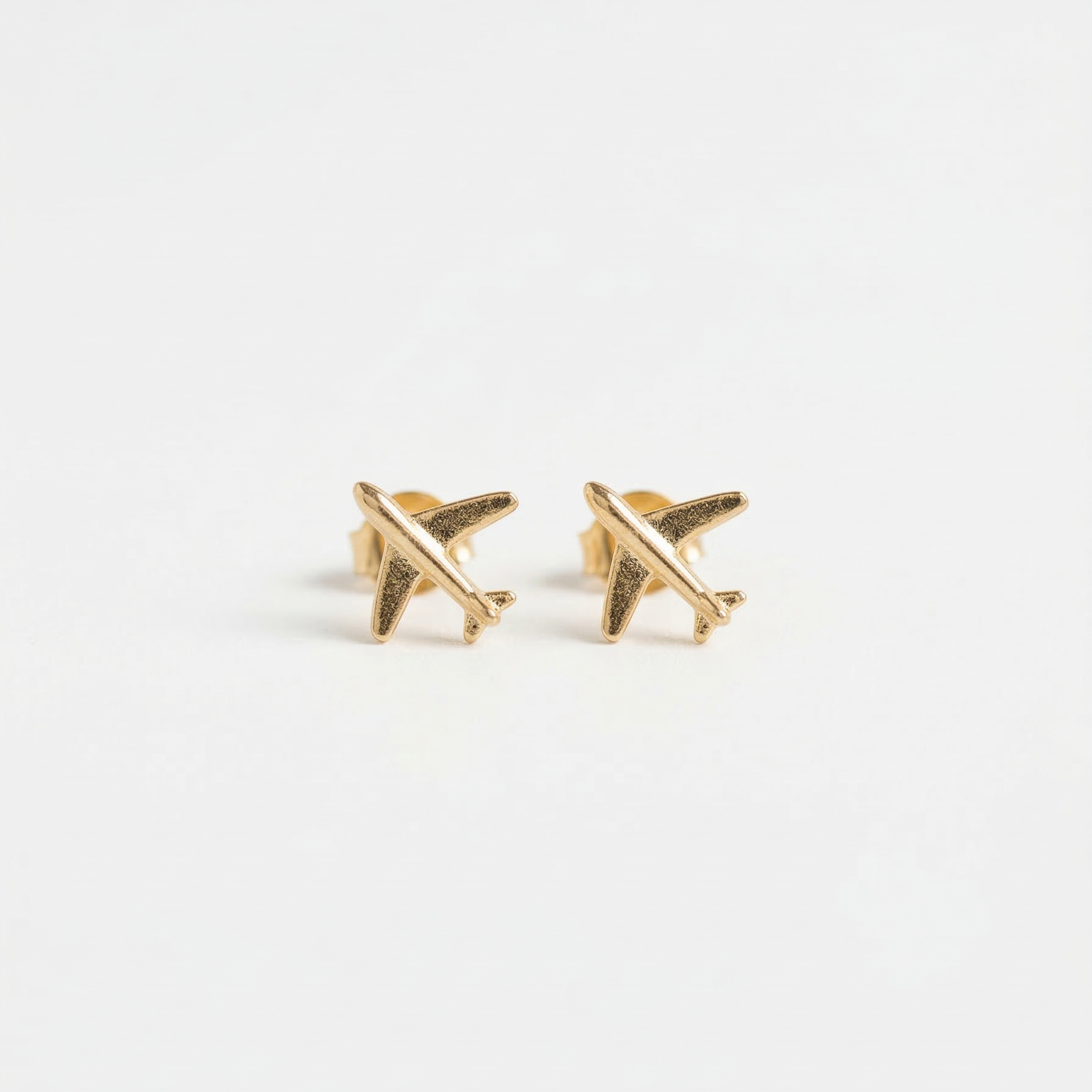 The Wanderlust Jet Studs – Champagne Gold Minimalist Airplane Earrings