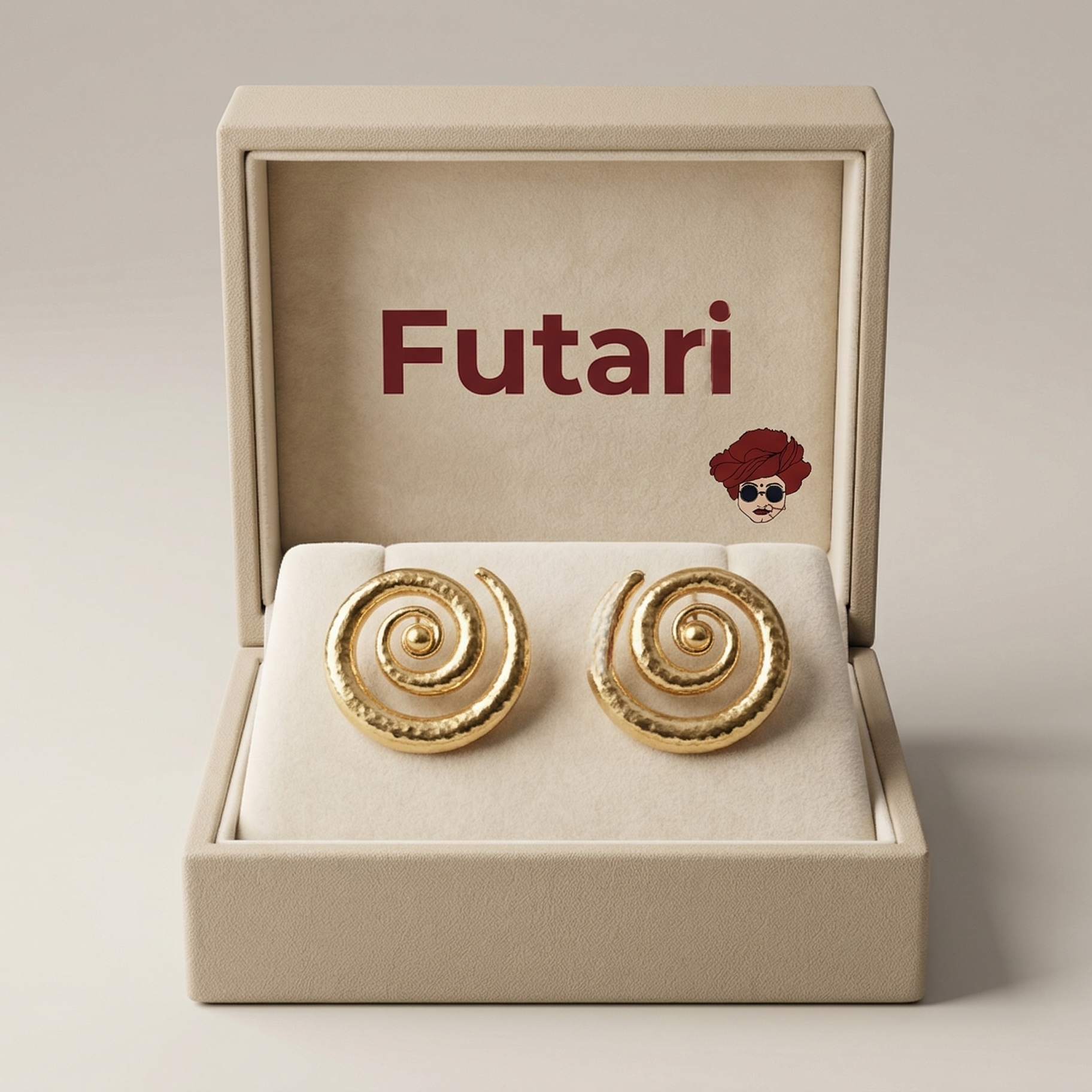 Gold spiral earrings in a 'Futari' branded box on a light gray background