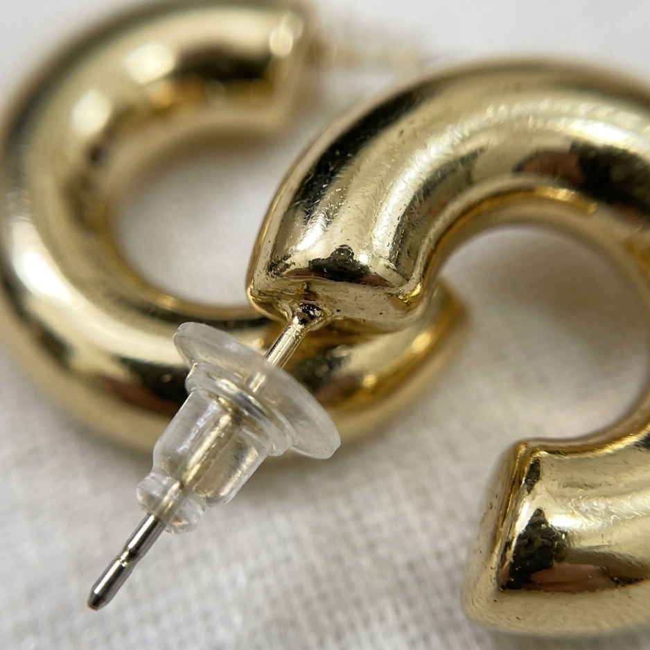Gold hoop earrings on a white background