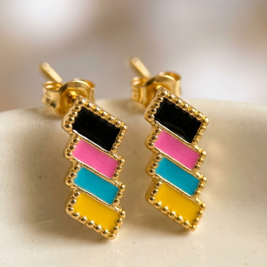 Colorful geometric earrings on a neutral background