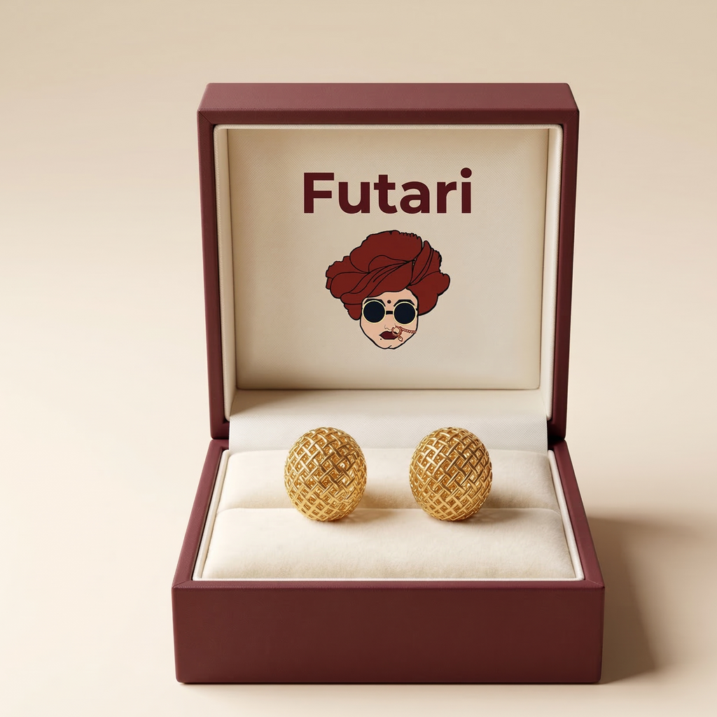 Gold earrings in an open 'Futari' jewelry box on a beige background