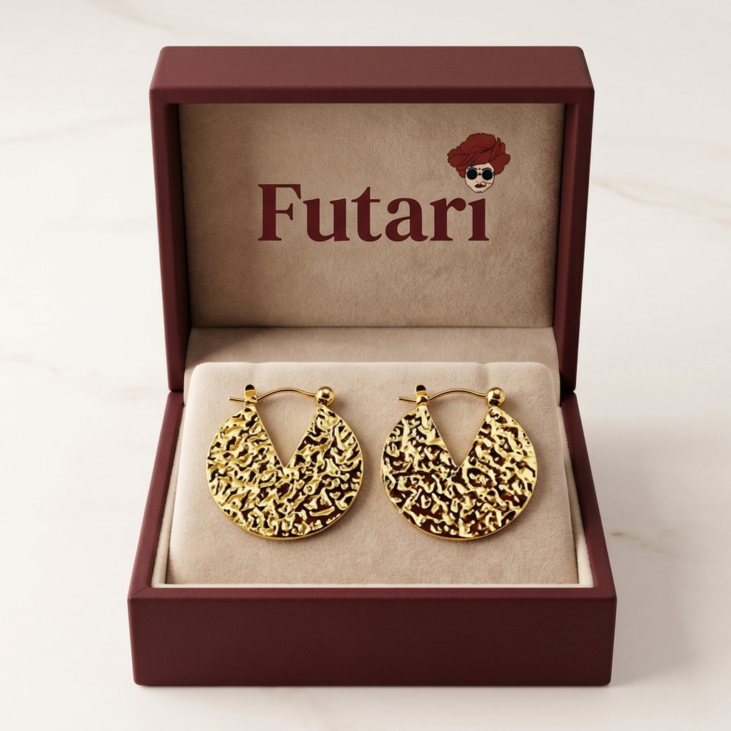 Gold hoop earrings in a 'Futari' branded box on a white background