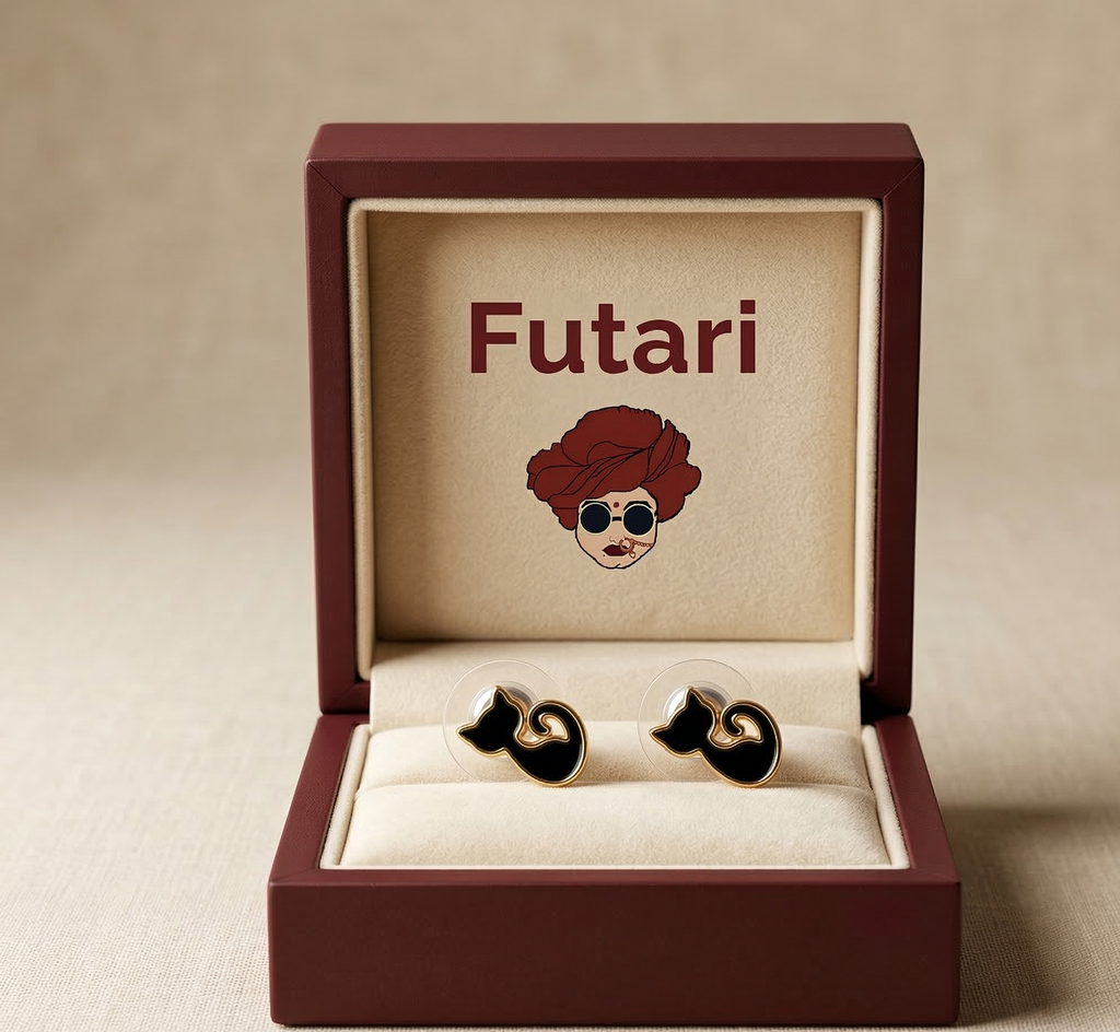 Jewelry box with 'Futari' branding and earrings inside on a beige background