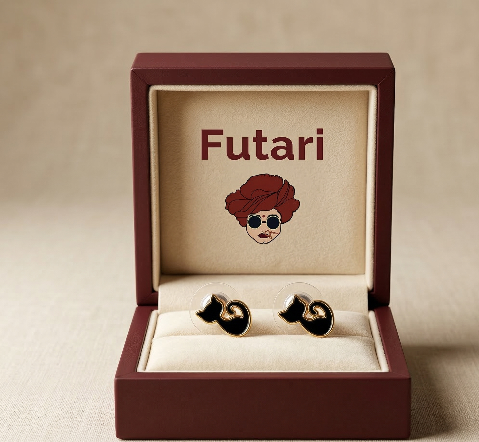 Jewelry box with 'Futari' branding and earrings inside on a beige background