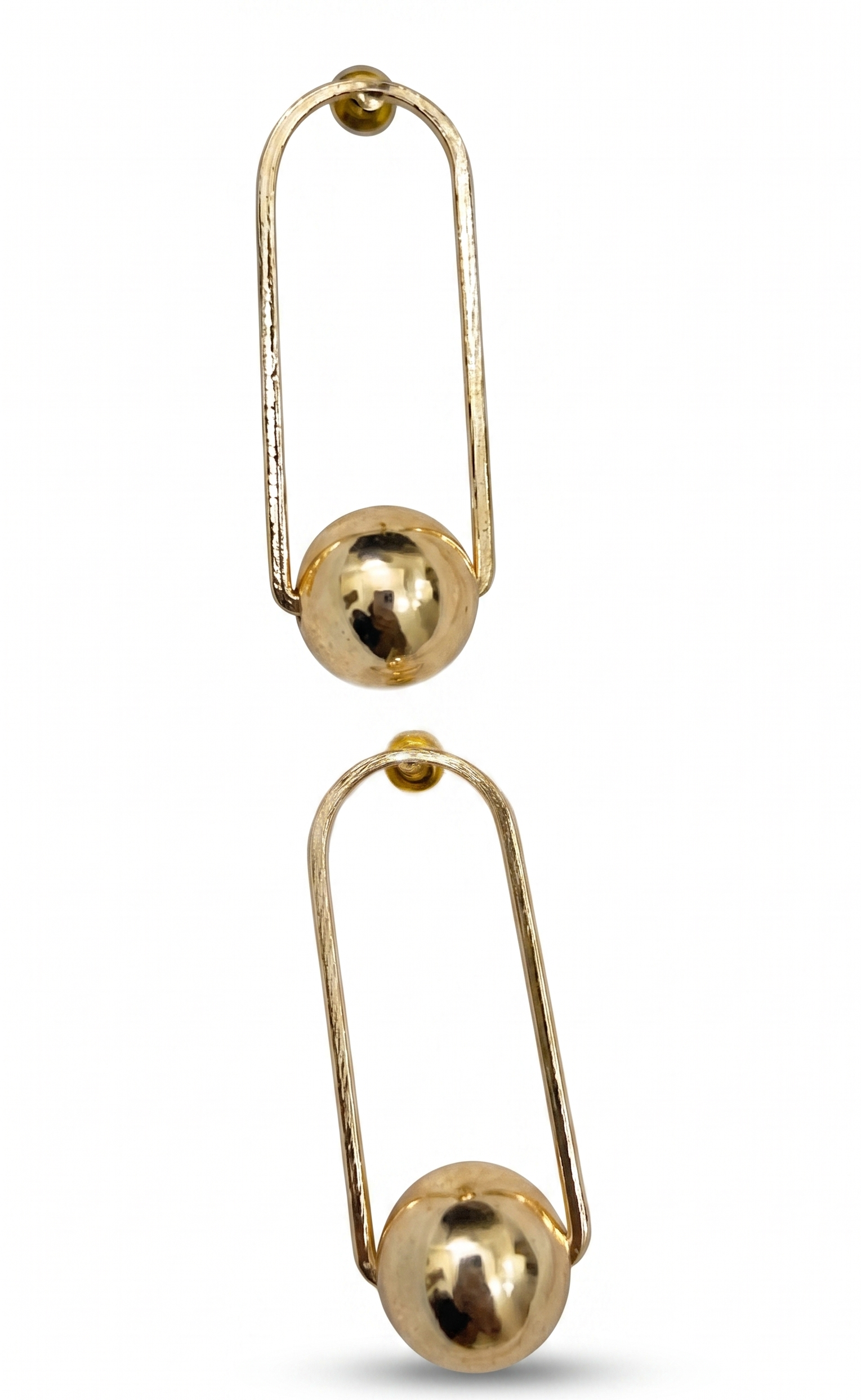 Two gold safety pin earrings on a white background