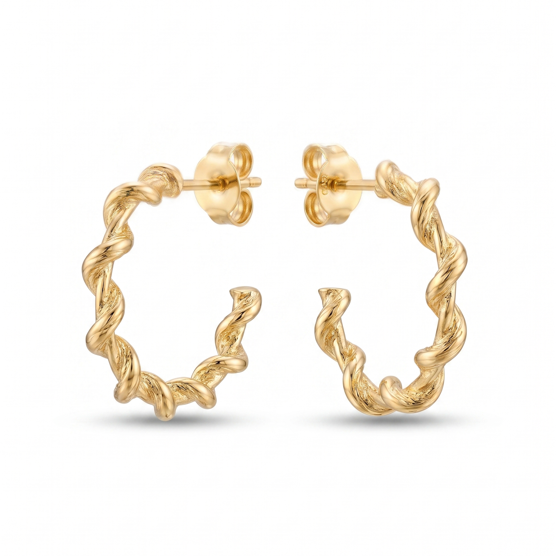 Gold hoop earrings on a white background