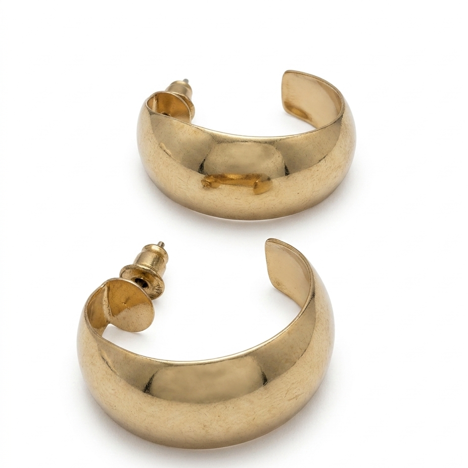 Pair of gold hoop earrings on a white background