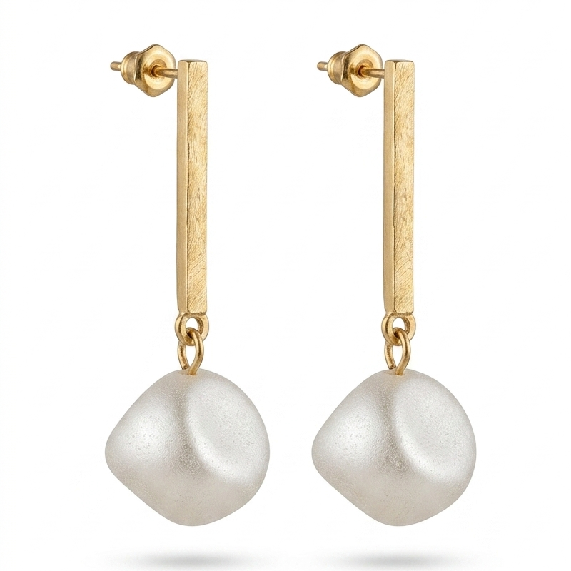 Gold earrings with white pearls on a white background