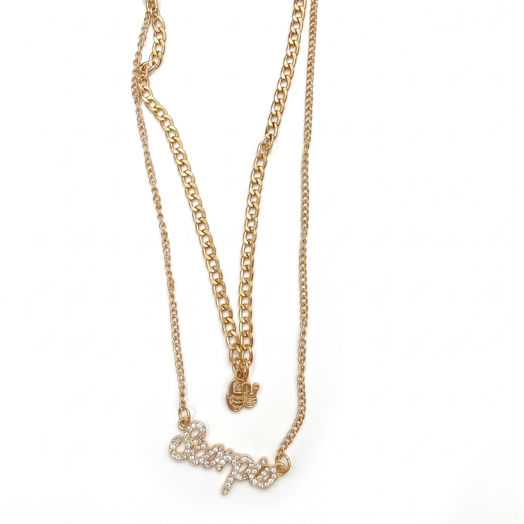 Gold chain necklace with a bow pendant on a white background