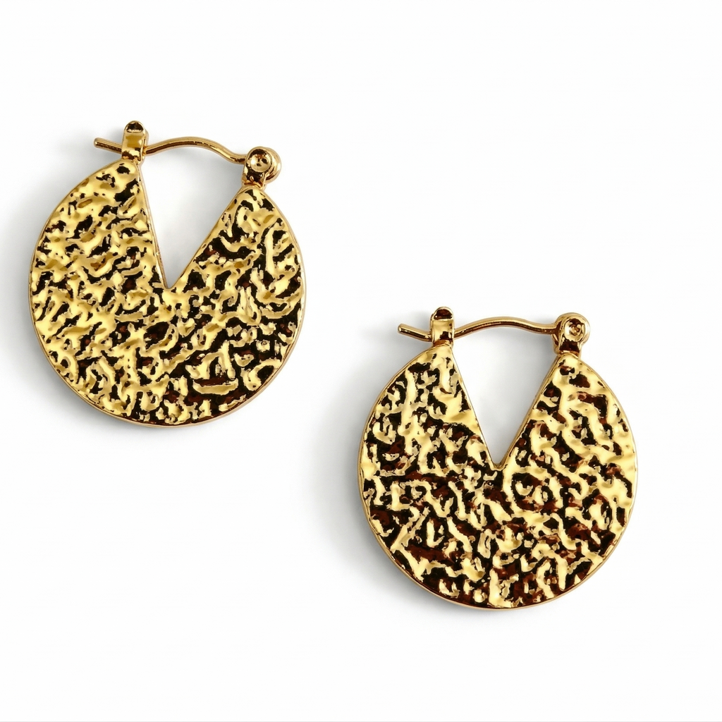Gold hoop earrings with textured design on a white background