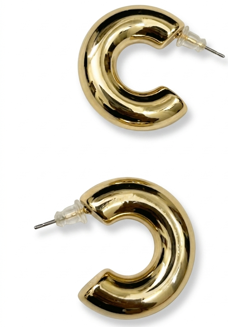 Gold hoop earrings on a white background
