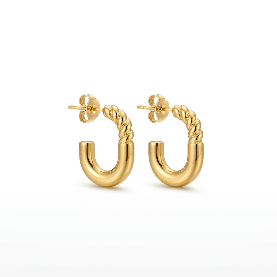 Gold hoop earrings on a white background