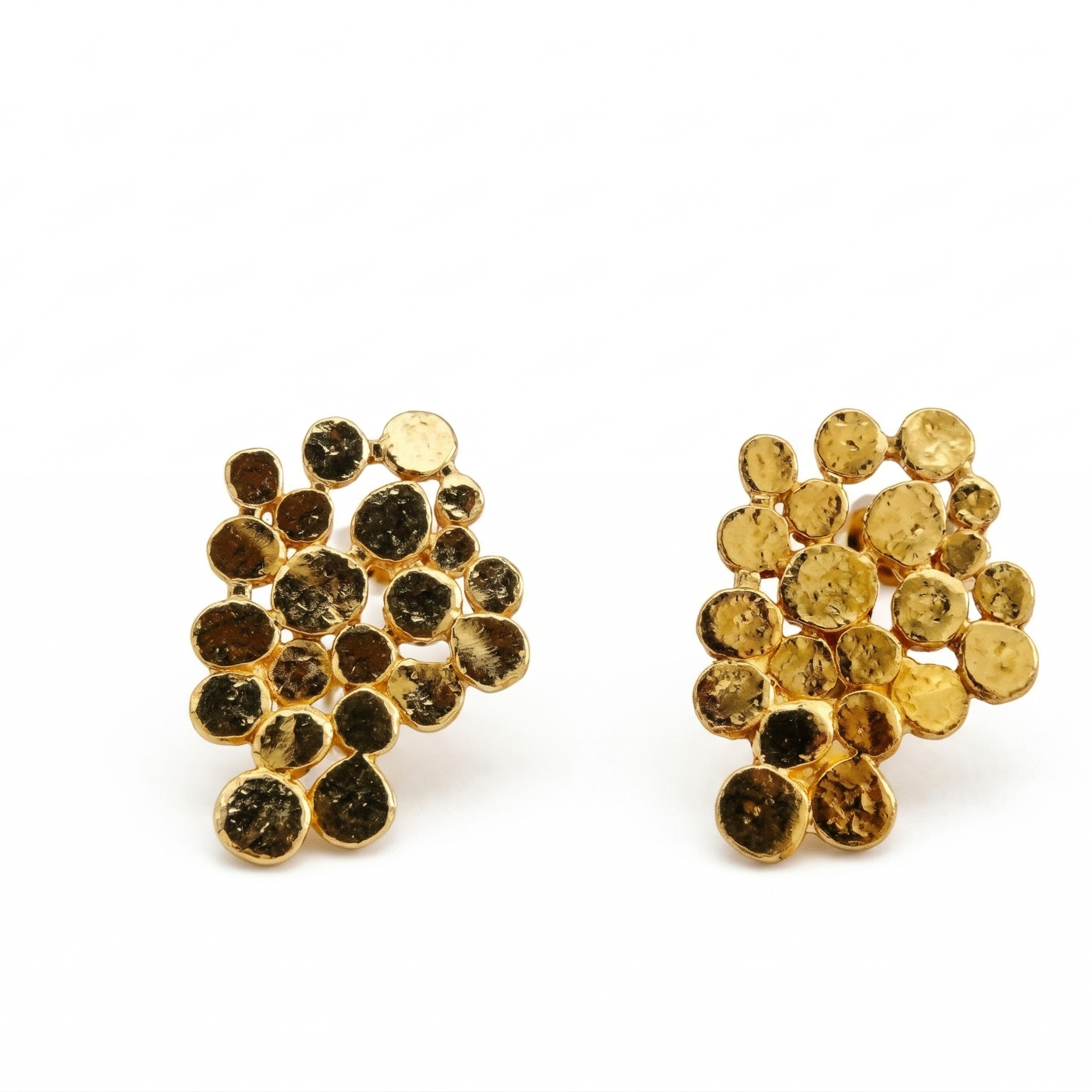 Pair of gold and black bead earrings on a white background