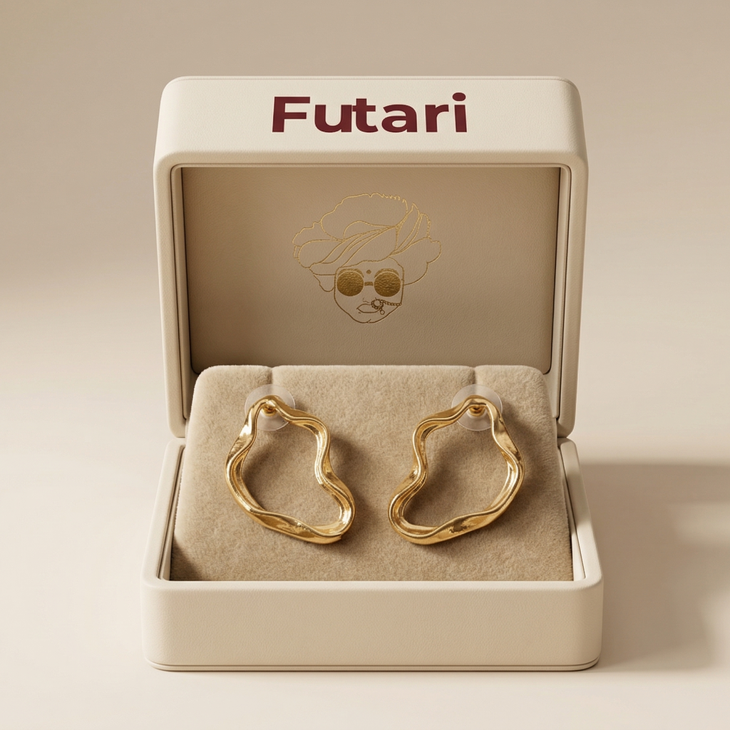 Gold hoop earrings in an open 'Futari' jewelry box on a beige background